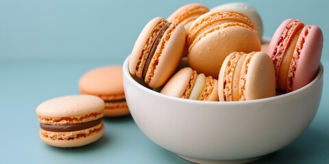Colorful macarons in blue bowl.