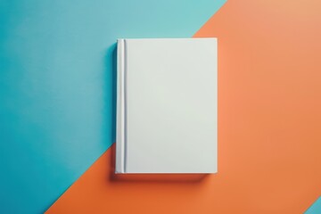Naklejka premium White book and bookmark on blue and orange backdrop