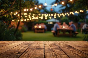 Wooden table in backyard at night with party blurred background