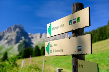 The signpost with direction to the Refuge de la Balme mountain hut in the French Alps. Part of the Tour du mont blanc challenge. 