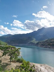 Fototapeta premium lake in the mountains reservoir rocky shore trees