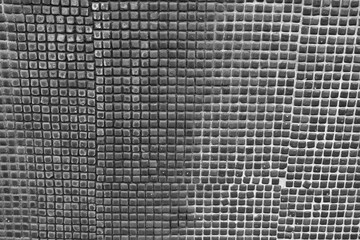 Mosaic Tile Pattern Close-Up. Close-up of a mosaic design with small, square tiles in various...