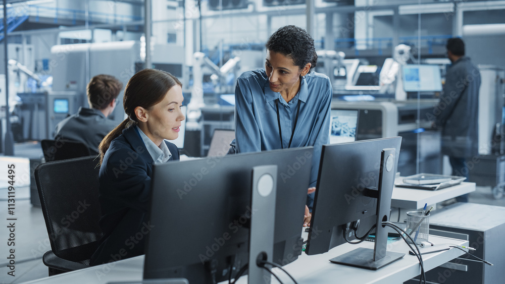 Poster Caucasian Female Engineer And Hispanic Product Manager Using Desktop Computer And Talking At Automated Factory With Robotic Hands. Diverse Colleagues Discussing New High-Tech Devices Production.