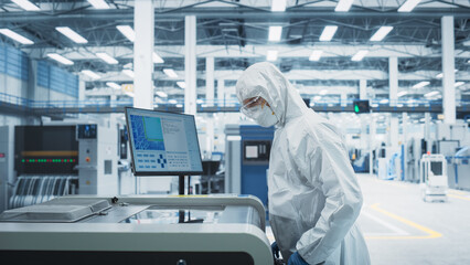 Printed Circuit Board Production At Electronics Factory: Technician In Sterile Suit Using Soldering...