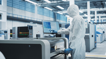 Printed Circuit Board Production In Electronics Factory Cleanroom: Scientist In Sterile Suit Using...