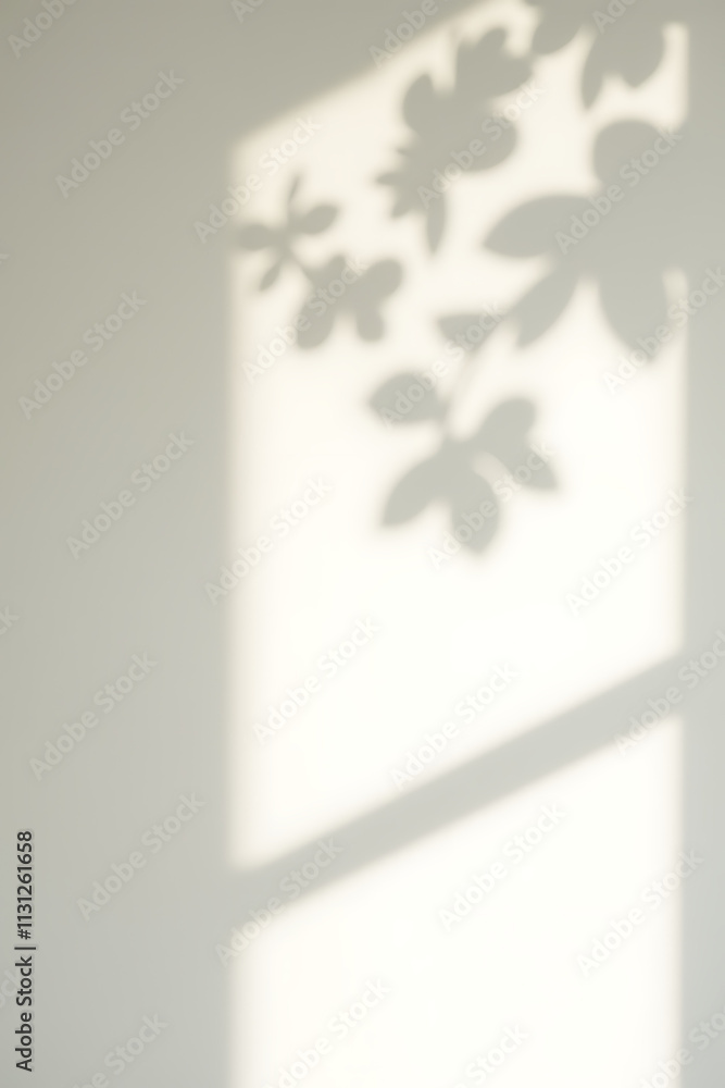 Poster soft filtered light through leafy branches creates a beautiful shadow effect on a white wall suitabl