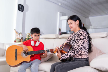 Little teenager takes guitar lessons on vacation to learn a new hobby