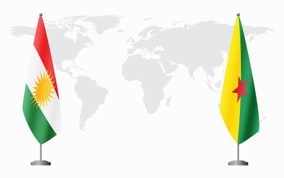 Kurdistan and French Guiana flags for official meeting against background of world map.