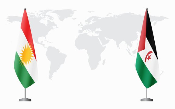 Kurdistan and Sahrawi Arab Democratic Republic flags for official meeting against background of world map.