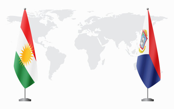 Kurdistan and Sint Maarten flags for official meeting against background of world map.