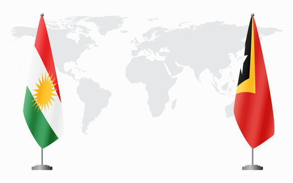 Kurdistan and East Timor flags for official meeting against background of world map.