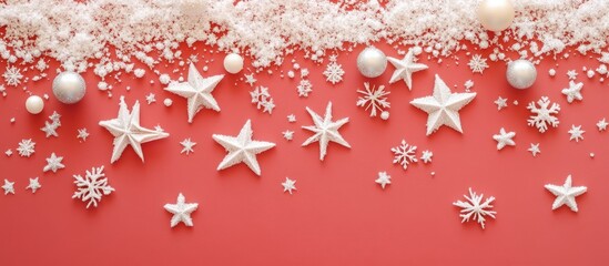 Winter holiday festive flat lay composition featuring white stars and snowflakes on a vibrant red background for Christmas and New Year celebrations