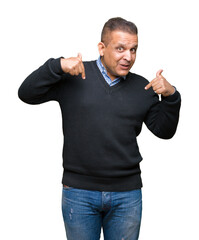 Fototapeta premium Handsome middle age man over isolated background looking confident with smile on face, pointing oneself with fingers proud and happy.