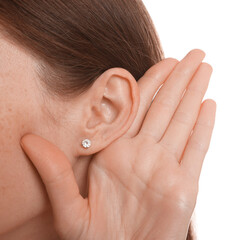 Woman showing hand to ear gesture on white background, closeup