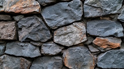 Obraz premium Textured dark gray stone wall background for design and creative projects offering rustic and natural aesthetic appeal