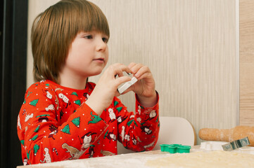 Caucasian boy crafing decorations or opening presents  at home candid shot candind shot winter holiday activities