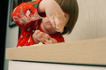 Caucasian boy crafing decorations or opening presents  at home candid shot candind shot winter holiday activities