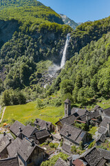 The famous waterfall behind the mountain village Foroglio in the Maggia Valley in Itanlian speaking...