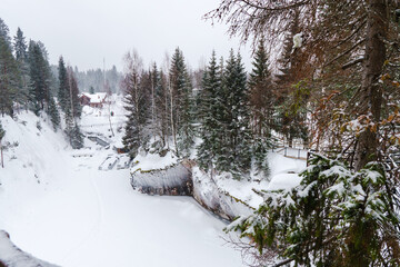 Winter in the park. Karelia Ruskeala Nature Reserve in winter. It is snowing in the forest.