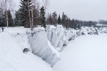 Winter in the park. Karelia Ruskeala Nature Reserve in winter. It is snowing in the forest.