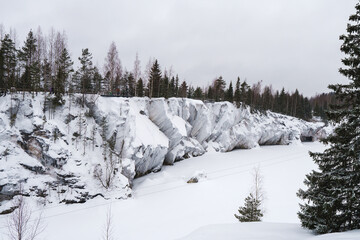 Winter in the park. Karelia Ruskeala Nature Reserve in winter. It is snowing in the forest.