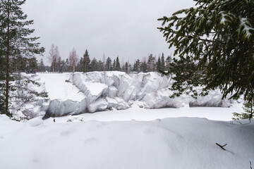 Winter in the park. Karelia Ruskeala Nature Reserve in winter. It is snowing in the forest.