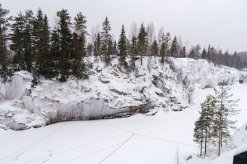 Winter in the park. Karelia Ruskeala Nature Reserve in winter. It is snowing in the forest.