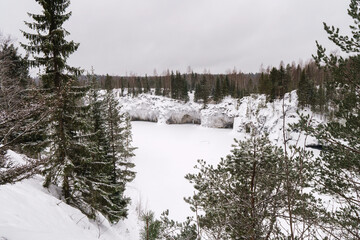 Winter in the park. Karelia Ruskeala Nature Reserve in winter. It is snowing in the forest.