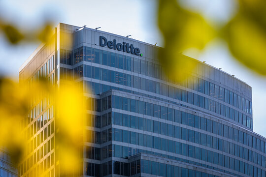 Washington, DC, USA - 24 October 2021: Deloitte Company Logo at the Facade of the Arlington Branch Building; Copy Space and blurred Foreground
