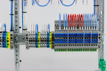 Electrical screw terminals for connecting wires in an electrical switchboard. Soft focus. Close-up.