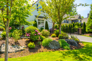 Two story luxury house with nice summer  landscape in Vancouver, Canada, North America. Day time on...