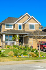 Two story luxury house with nice summer  landscape in Vancouver, Canada, North America. Day time on June 2024.