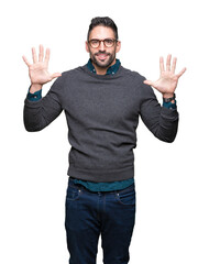 Fototapeta premium Young handsome man wearing glasses over isolated background showing and pointing up with fingers number ten while smiling confident and happy.