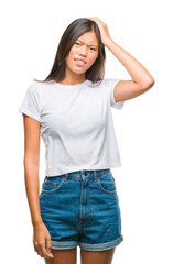 Obraz premium Young asian woman over isolated background suffering from headache desperate and stressed because pain and migraine. Hands on head.