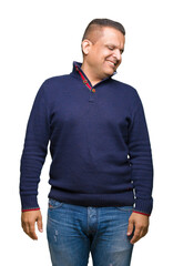 Fototapeta premium Middle age arab man over isolated background looking away to side with smile on face, natural expression. Laughing confident.