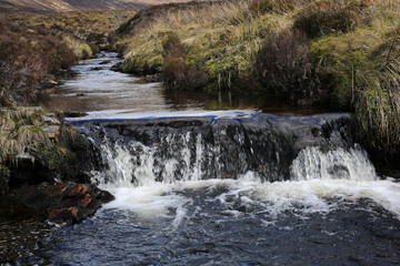 Obraz premium Ascent to Ben Wyvis along the Allt a' Bhealaich Mhoir stream - Ross and Cromarty - Scotland - UK