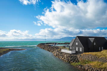 Picturesque Hofsá river and Hofsós village with traditional Icelandic houses in Norðurland vestra.