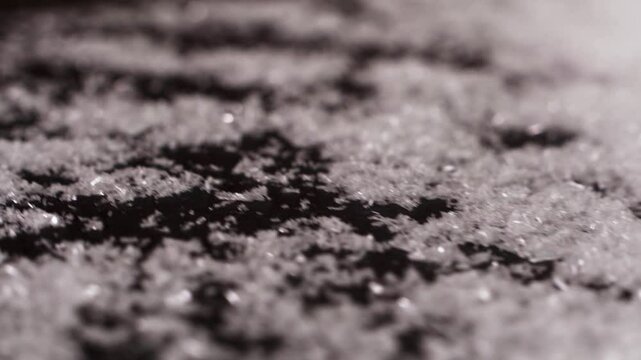 Close up of mono Monosodium glutamate (MSG)in spoon on white