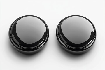 Two black knob covers sit on a clean white surface, ready for installation