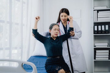 Doctor Assisting Elderly Patient to Recover