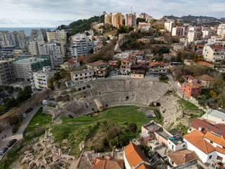 Aerial view of the ancient Roman amphitheater in Durres, Albania, surrounded by modern cityscape...