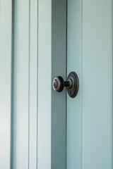 Obraz premium Black Door Knob on Light Blue Wooden Door