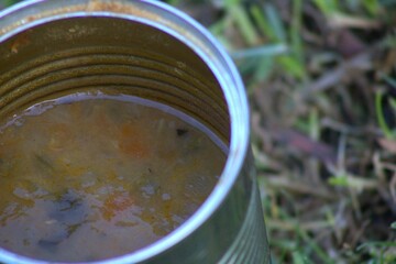 open tin can of soup