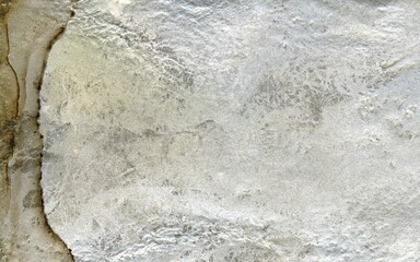 Close up of natural stone texture background. High resolution photo. Full frame. Abstract background and texture for design. Fossilized rock. Molten silver ingot, white metal.