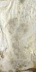 Close up of natural stone texture background. High resolution photo. Full frame. Abstract background and texture for design. Fossilized rock. Molten silver ingot, white metal.