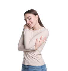 Fototapeta premium Charming young woman hugging herself on white background