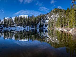Mirror image of trees in Granite Lake, California