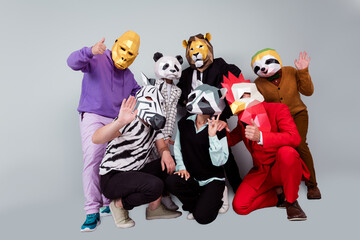 Full body portrait of zebra gorilla raccoon lion panda sloth rooster mask people show thumb up wave...