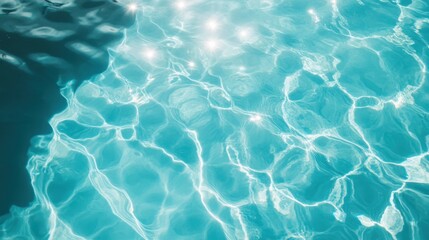 Obraz premium Beautiful view of swimming pool surface with clear blue water with sunlight reflections on wave. Summer vacation concept background