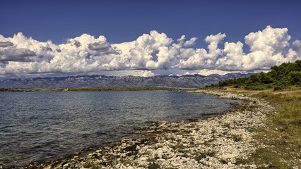 clouds hanging between the sea 